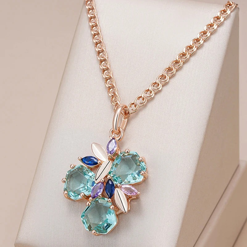 18k rose gold necklace in the shape of a flower with aquamarine stones inlaid - ZAR