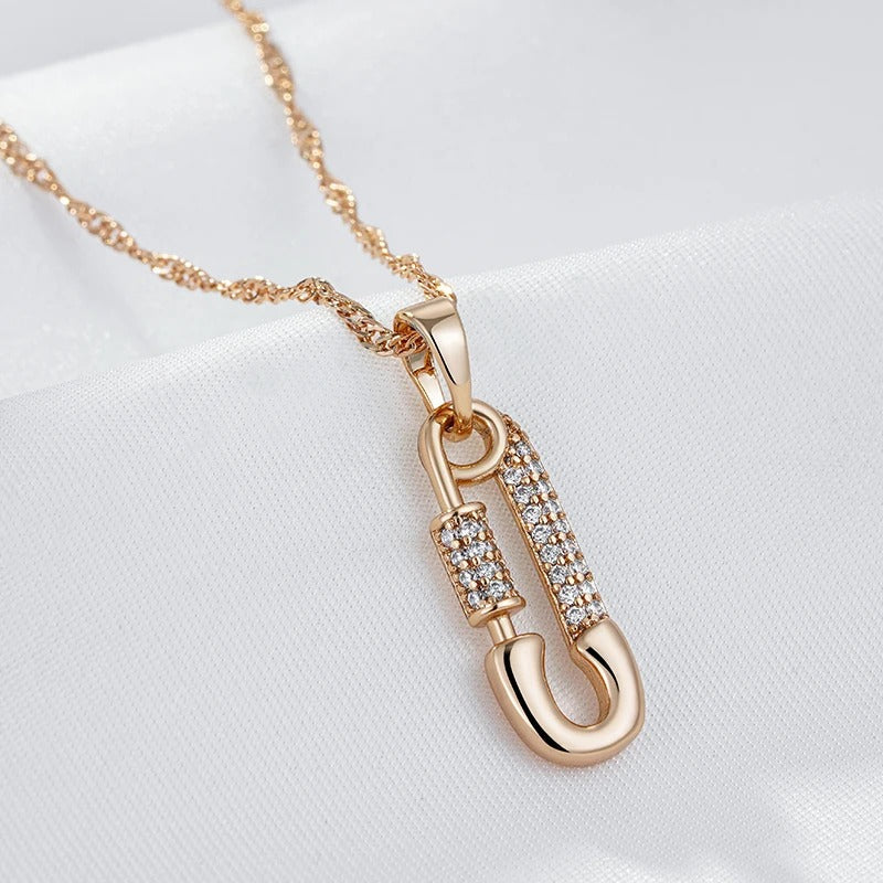 Pendant necklace with pin shape and zircons in 18K Rose Gold Plated